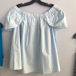 Light blue over the shoulder shirt